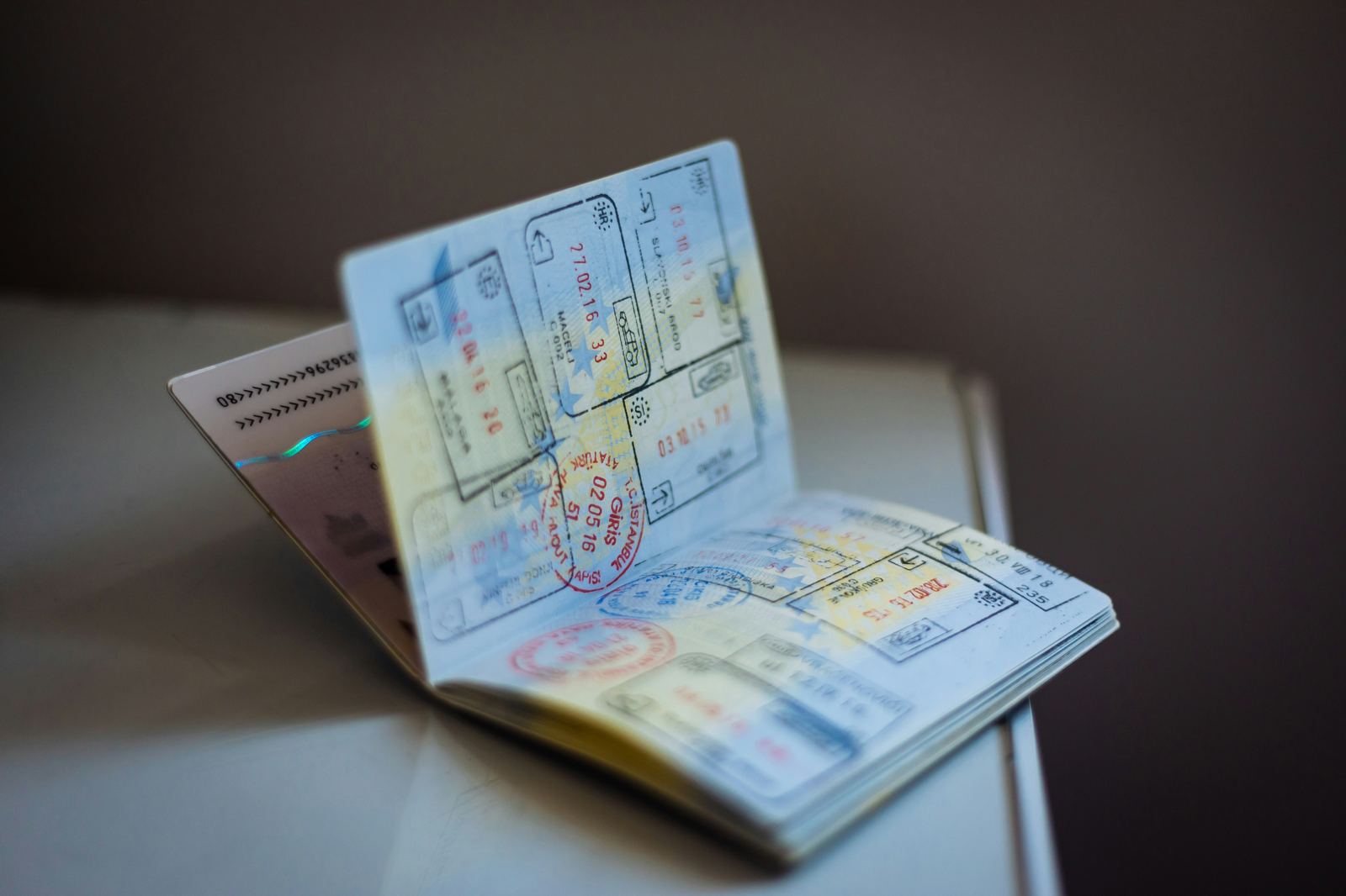 Passport open to pages full of travel stamps